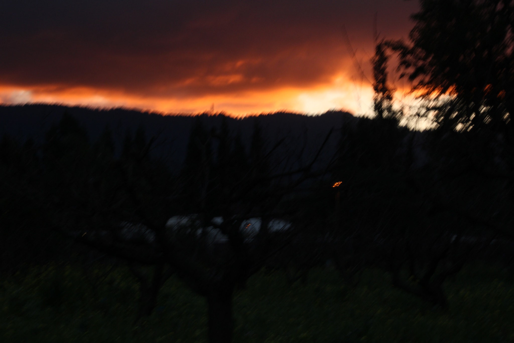 Dark motion-blurred sunset, deep red sky